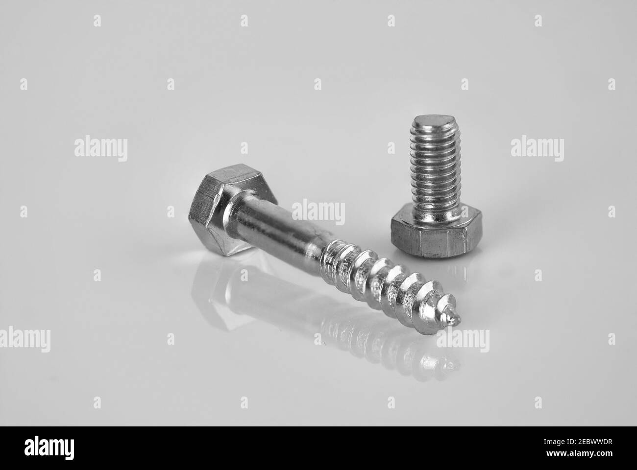 Closeup of hex bolts on a white surface Stock Photo Alamy