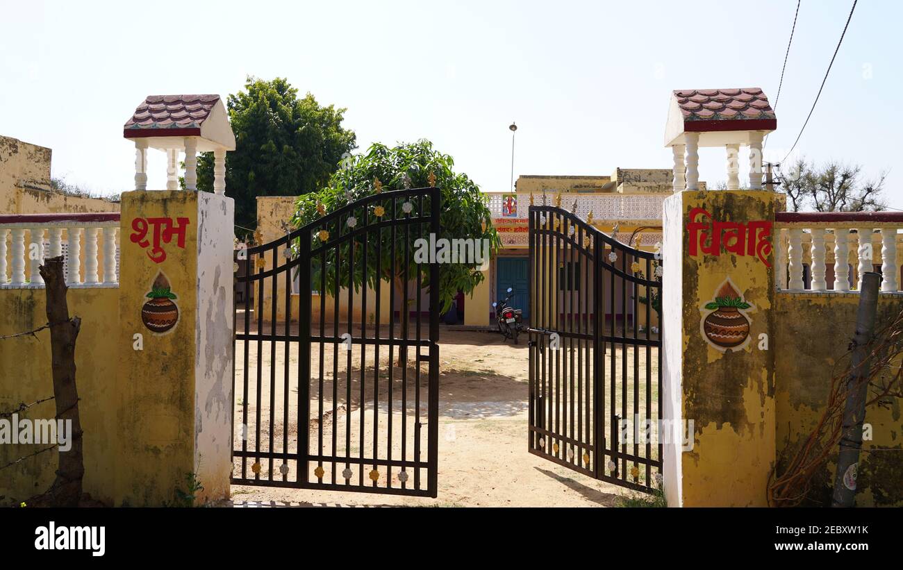 08 February 2021- Khatoo, Jaipur, India. Open enter gate of House. Half opened gate closeup with black color. Traditional Indian family house gate wit Stock Photo