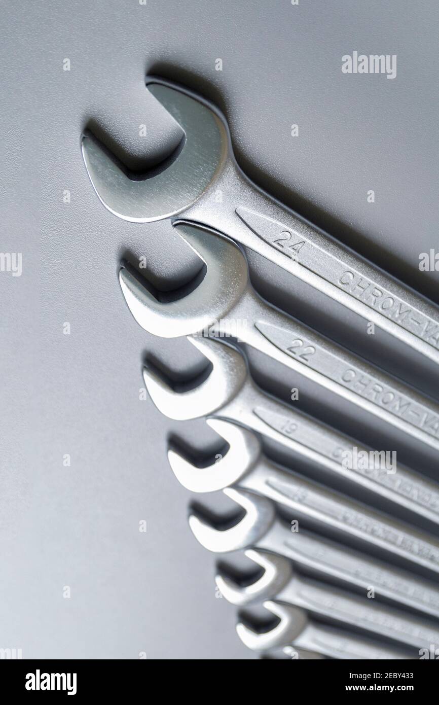 Cut-out wrenches horizontally placed from the biggest to the smallest in a  row. Top view composition. Hand tool. Tools for carpentry work. Type of fas  Stock Photo - Alamy