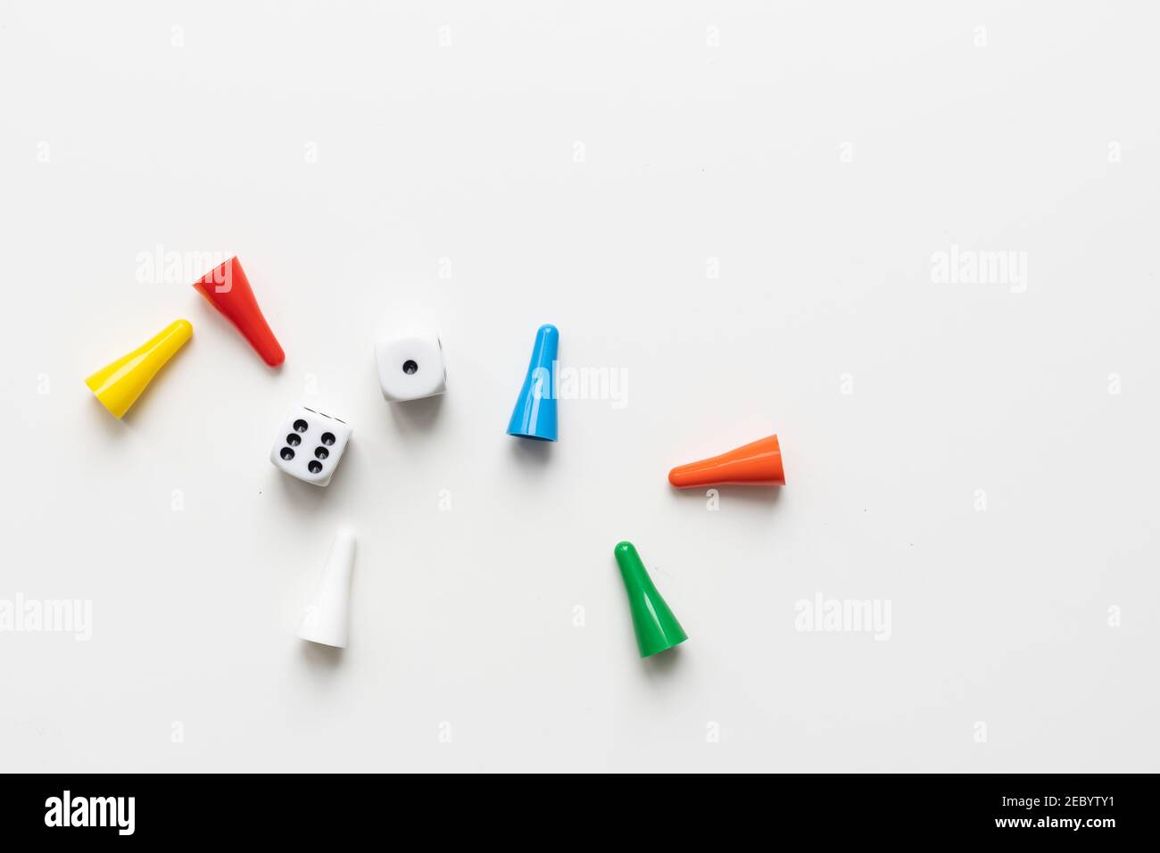 Game cubes, chips, hourglass on a white background. The concept of home Board games, classes at home with children, developmental training, logic Stock Photo