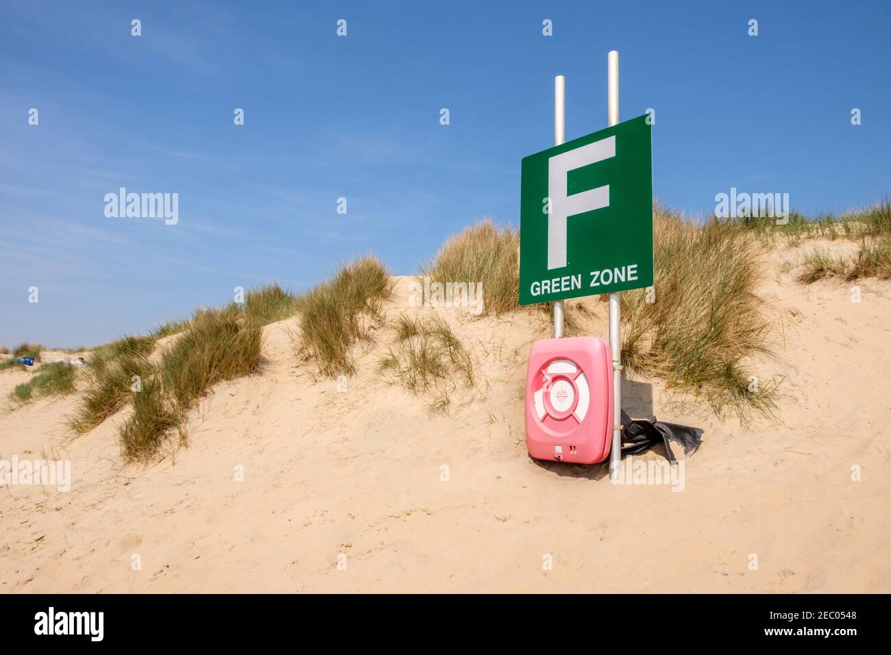 Beach zoned area with life belt in sand dunes by the sea at Camber Sands, Sussex, England, GB, UK Stock Photo