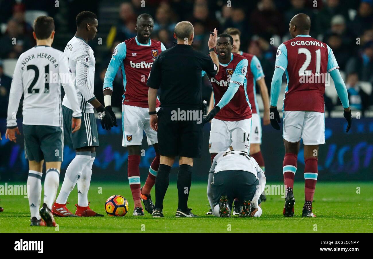 Britain Football Soccer - West Ham United v Manchester United - Premier League - London Stadium - 2/1/17 West Ham United's Pedro Obiang and Cheikhou Kouyate react after referee Mike Dean awards Manchester United a free kick  Reuters / Eddie Keogh Livepic EDITORIAL USE ONLY. No use with unauthorized audio, video, data, fixture lists, club/league logos or 'live' services. Online in-match use limited to 45 images, no video emulation. No use in betting, games or single club/league/player publications. Please contact your account representative for further details. Stock Photo