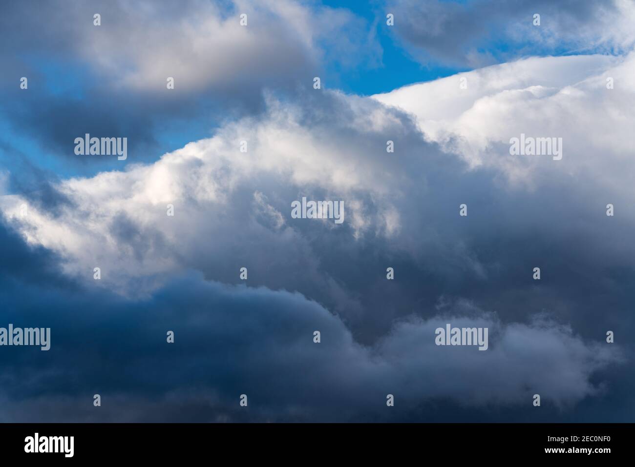 Dramatic thunderstorm clouds in blue sky before rain. Natural weather background Stock Photo