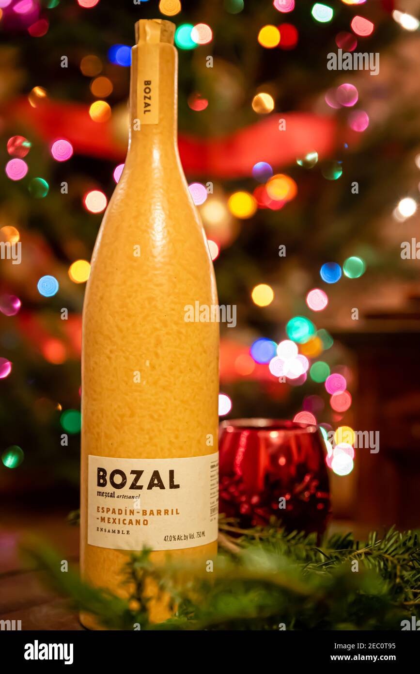 A bottle of mezcal liquor by Bozal with holiday lights in the background: Chicago, IL on November 19, 2020. Stock Photo