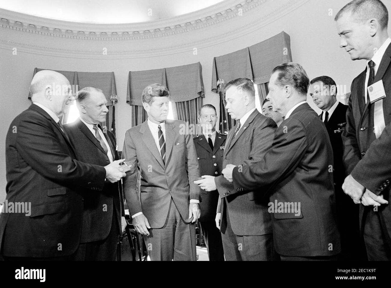Presentation of honorary life memberships in the armed services associations, 10:00AM. President John F. Kennedy receives honorary life memberships in four armed services organizations; representatives from each organization presented President Kennedy with gold membership cards. Left to right (in foreground): President of the Association of the United States Army, Lieutenant General Milton G. Baker; National Vice President of the Navy League, Harold E. Wirth; President Kennedy; President of the Marine Corps League, Raymond B. Butts; President of the Air Force Association, Major General John B Stock Photo