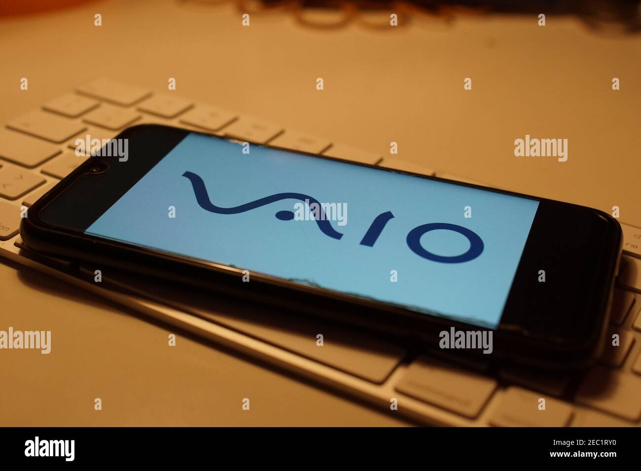 Smartphone with Sony Vaio logo on computer keyboard Stock Photo