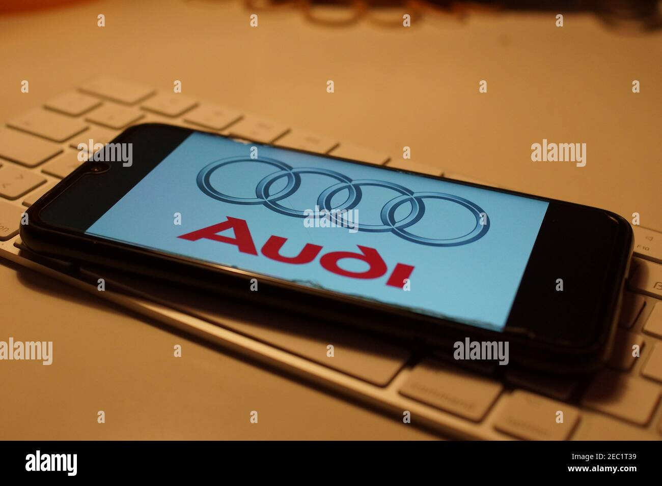 Smartphone with Audi logo on computer keyboard Stock Photo