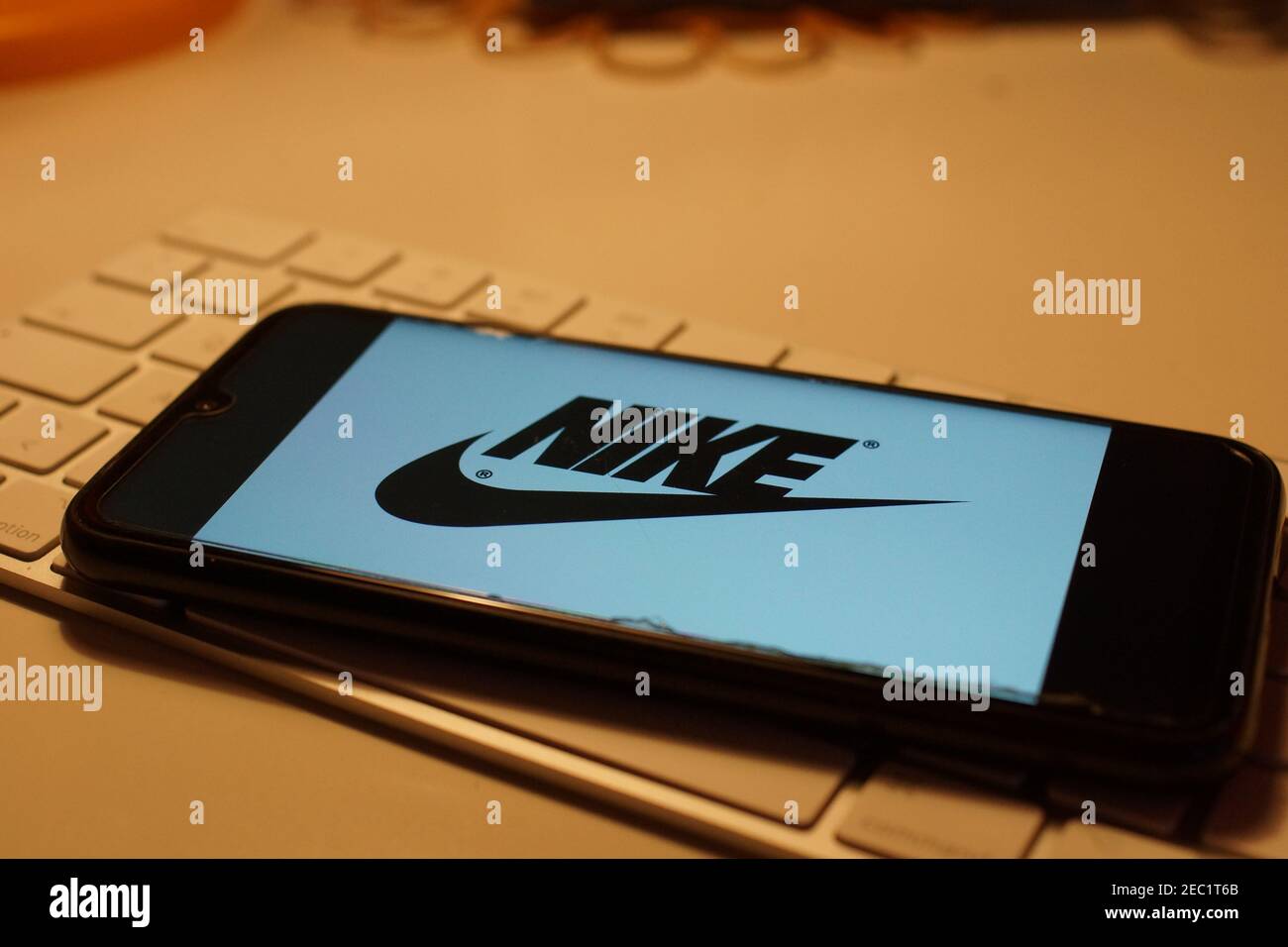 Smartphone with Nike logo on computer keyboard Stock Photo