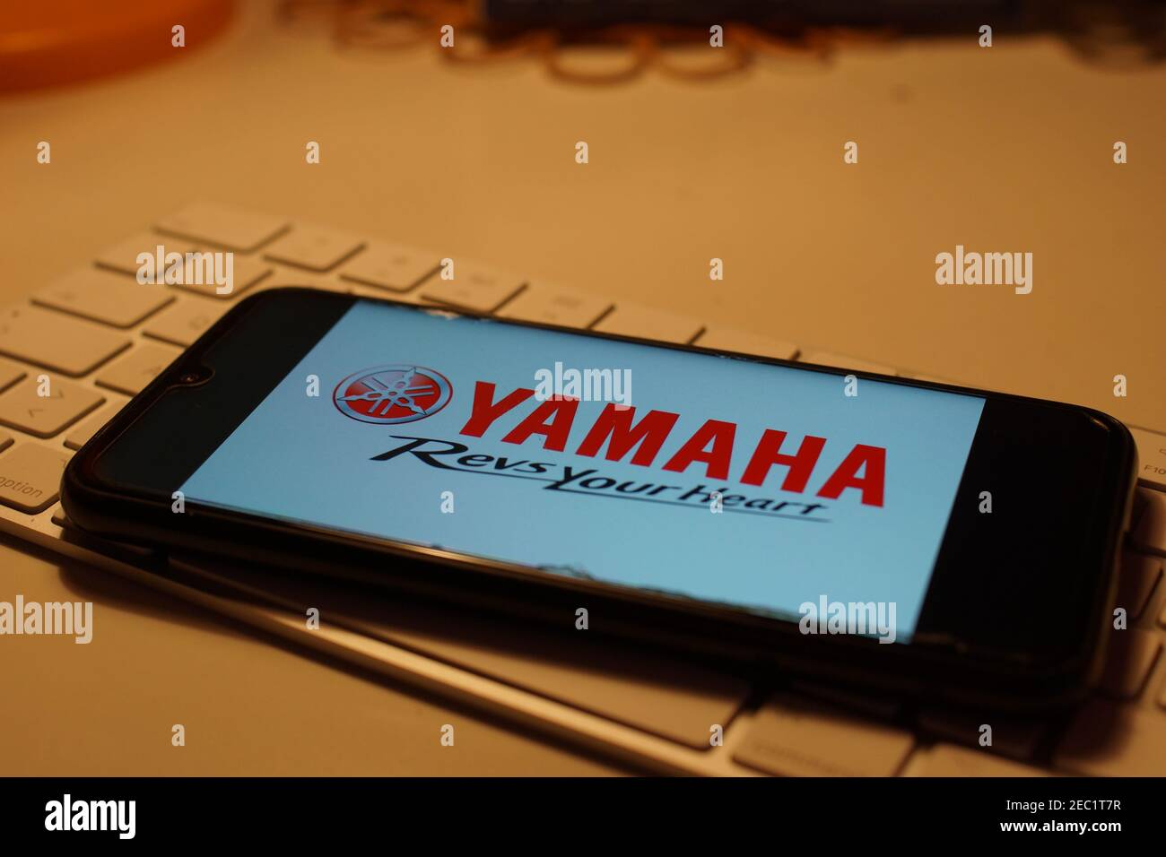 Smartphone with Yamaha logo on computer keyboard Stock Photo