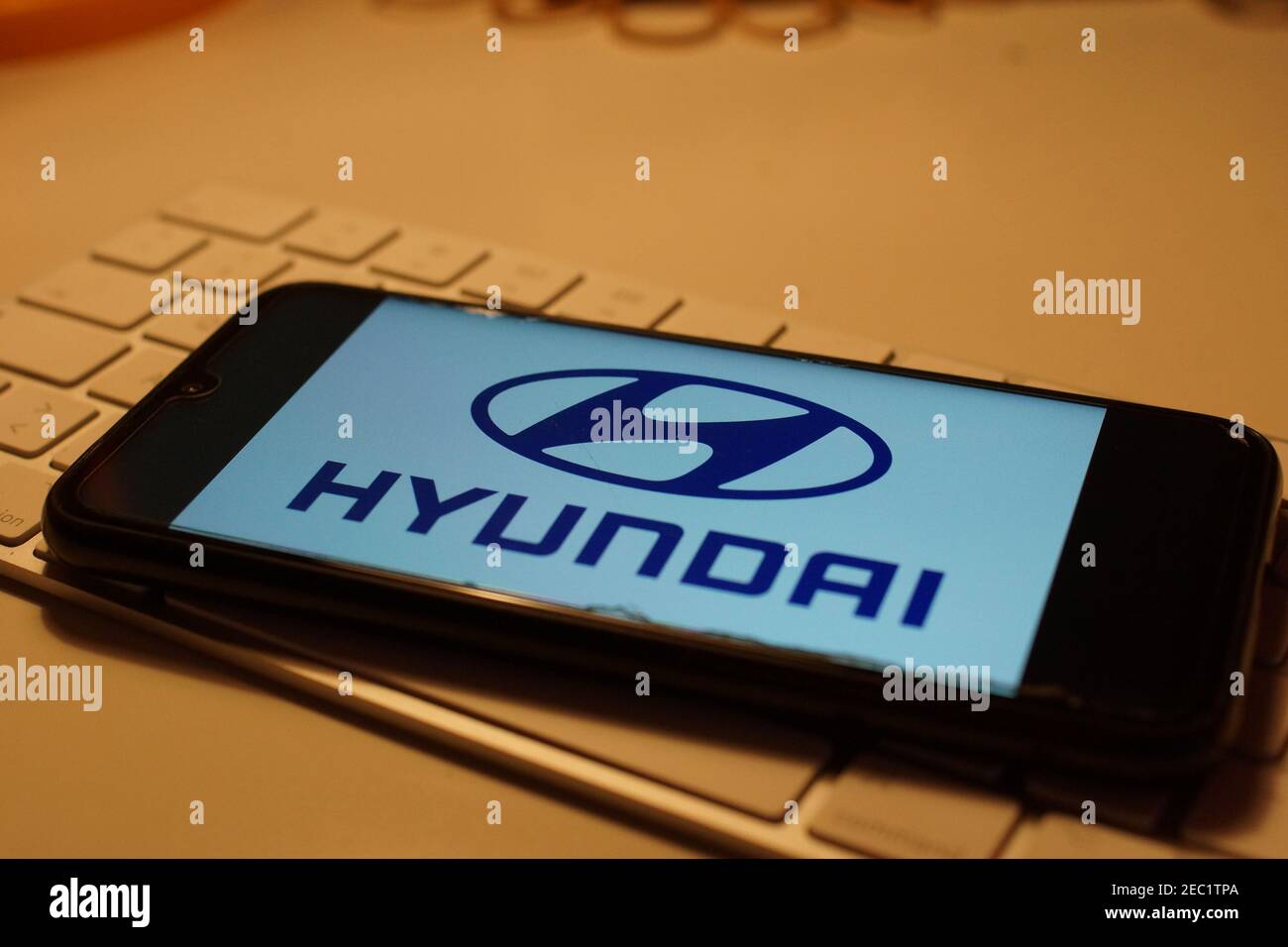 Smartphone with Hyundai logo on computer keyboard Stock Photo