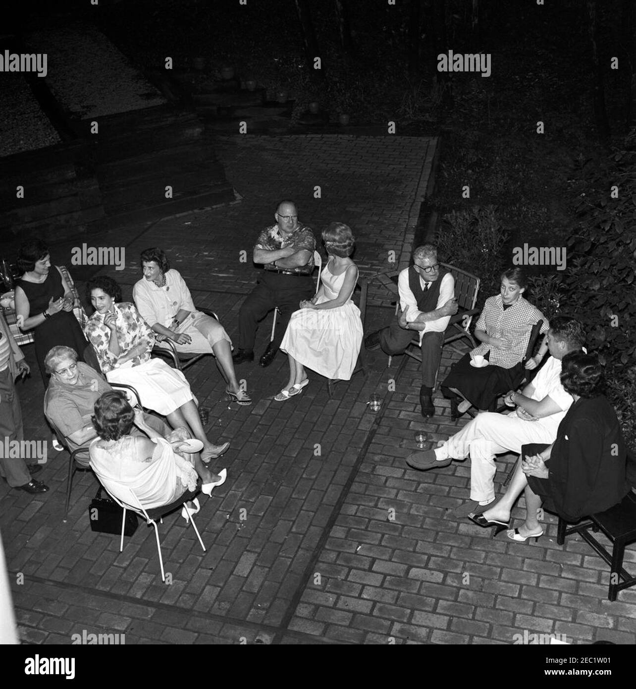 Memorial Day party at Press Secretary Pierre Salingeru0027s home. Memorial Day party at the residence of Press Secretary, Pierre Salinger. Clockwise (from bottom left): unidentified; Helen W. Ganss, of the Press Secretaryu2019s Office; unidentified woman (standing); three unidentified persons; Faith Hambrook Stoughton; National Park Service (NPS) photographer, Abbie Rowe; Barbara J. Coleman, of the Press Secretaryu2019s Office; White House photographer, Captain Cecil Stoughton; unidentified. Falls Church, Virginia. Stock Photo
