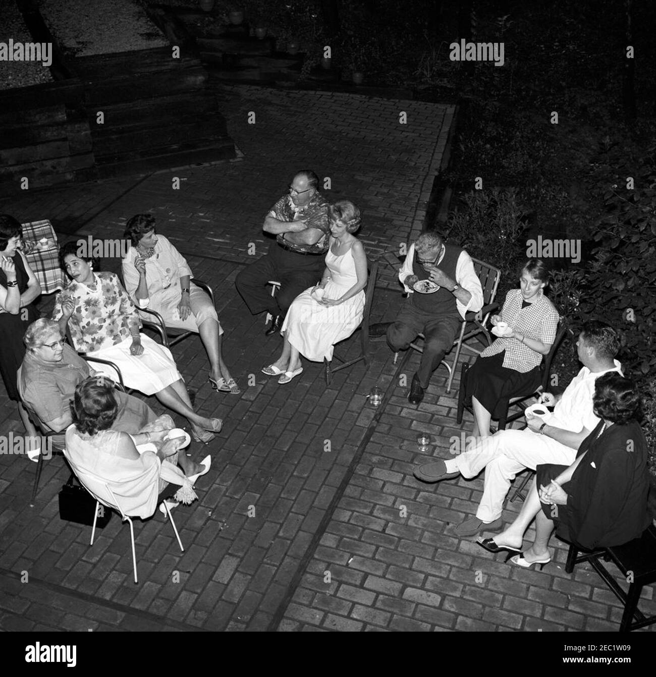 Memorial Day party at Press Secretary Pierre Salingeru0027s home. Memorial Day party at the residence of Press Secretary, Pierre Salinger. Clockwise (from bottom left): unidentified; Helen W. Ganss, of the Press Secretaryu2019s Office; unidentified woman (standing); three unidentified persons; Faith Hambrook Stoughton; National Park Service (NPS) photographer, Abbie Rowe; Barbara J. Coleman, of the Press Secretaryu2019s Office; White House photographer, Captain Cecil Stoughton; unidentified. Falls Church, Virginia. Stock Photo