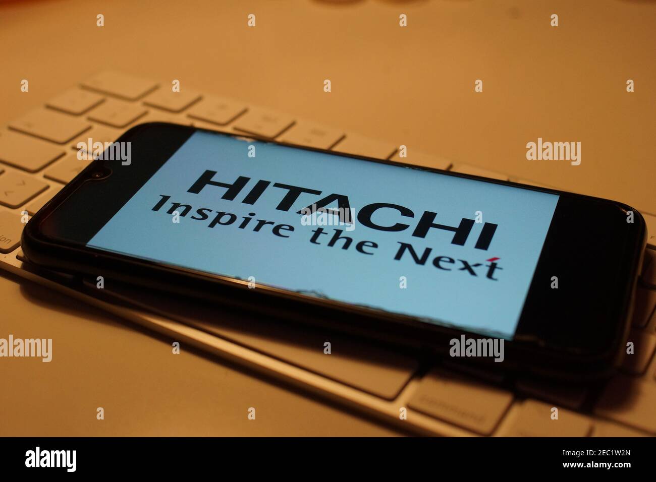 Smartphone with Hitachi logo on computer keyboard Stock Photo