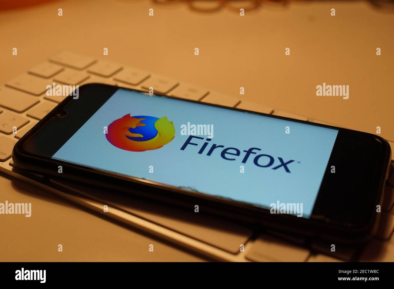 Smartphone with Firefox logo on computer keyboard Stock Photo