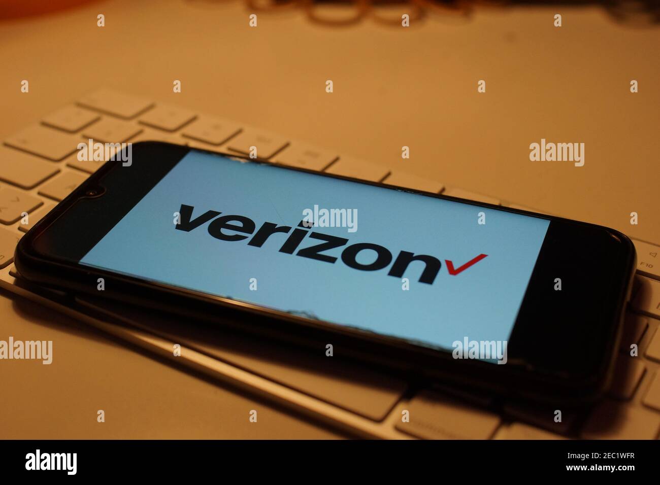 Smartphone with Verizon logo on computer keyboard Stock Photo