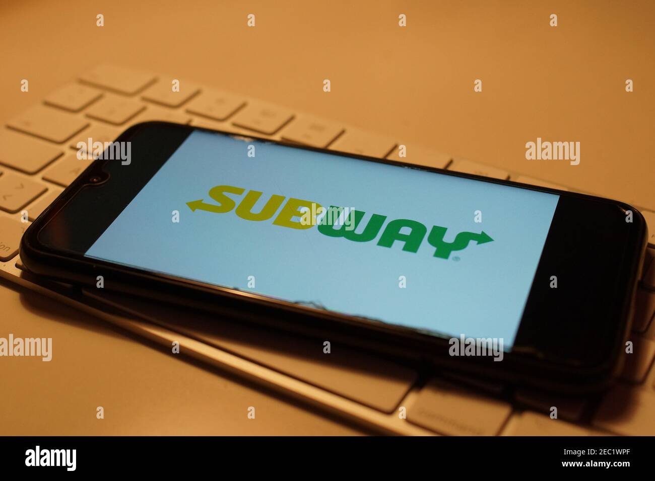 Smartphone with Subway logo on computer keyboard Stock Photo