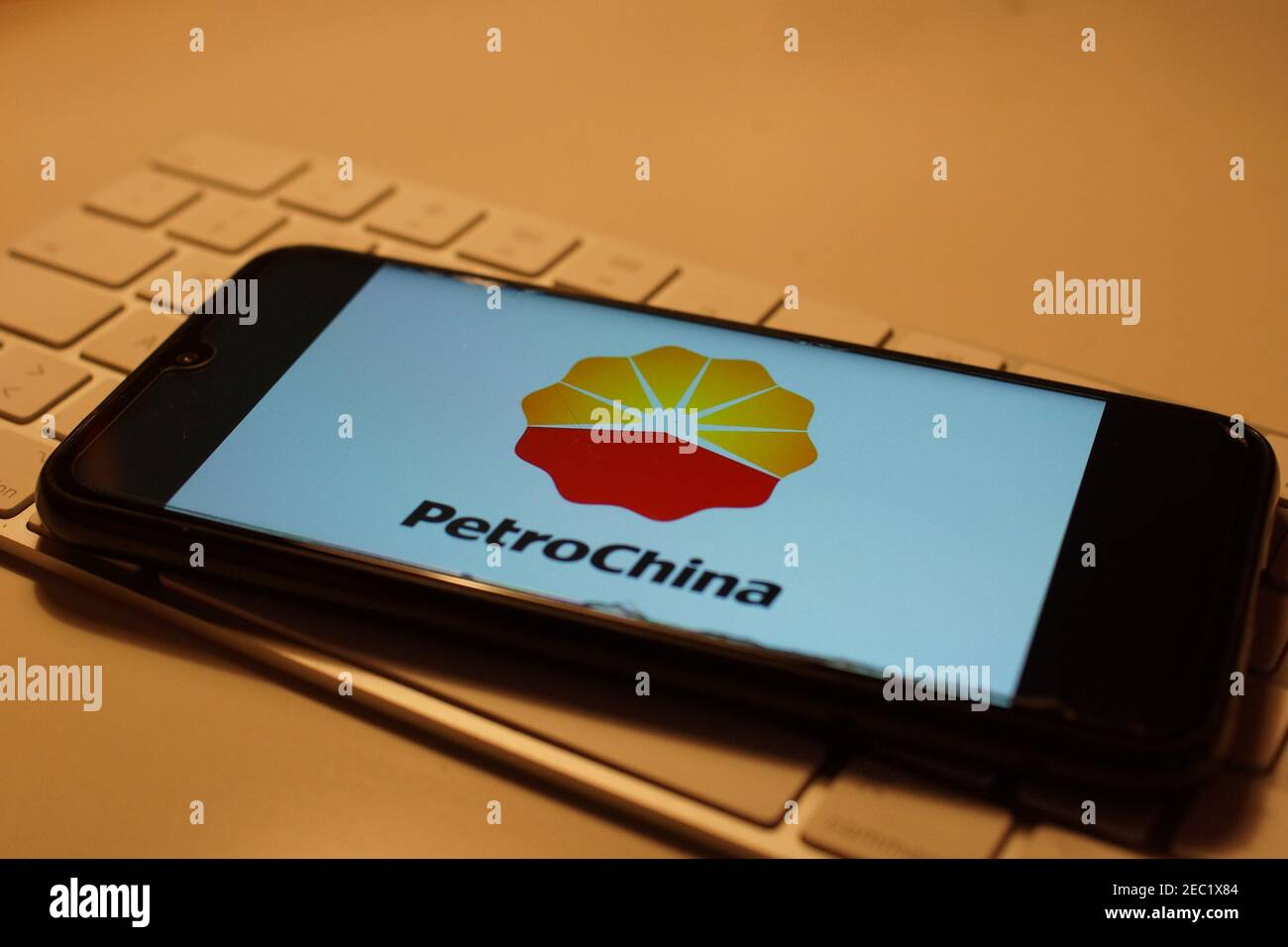Smartphone with Petrochina  logo on computer keyboard Stock Photo