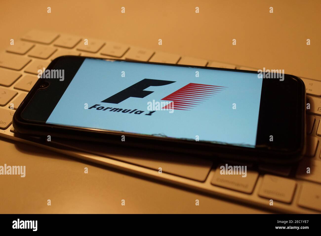 Smartphone with Formula 1 logo on computer keyboard Stock Photo