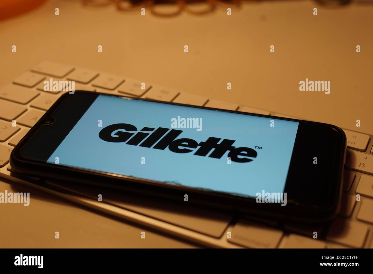 Smartphone with Gillette logo on computer keyboard Stock Photo