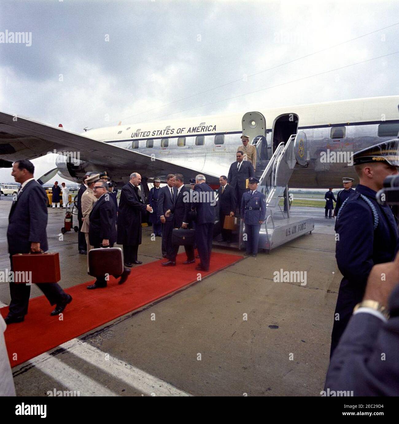 Arrival ceremony for Roberto F. Chiari, President of Panama, 11:00AM. President John F. Kennedy greets members of the official party of the President of Panama, Roberto F. Chiari, upon their arrival at the Military Air Transport Service (MATS) terminal. Left to right: former President of Panama, Ricardo Arias Espinosa; Protocol officer for the State Department, Richard J. Gookin (mostly hidden); Commandant of the Marine Corps, General David M. Shoup (partially hidden); unidentified; Military Aide to President Kennedy, General Chester V. Clifton (mostly hidden); U.S. Secretary of State, Dean Ru Stock Photo