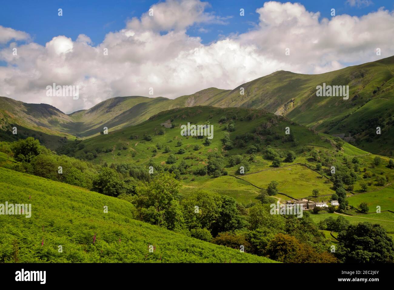 Troutbeck Park Farm, Cumbria.  The fell known as The Tongue is behind the farm, overshadowed by the higher peaks of Ill Bell and the Park Fells behind. Stock Photo