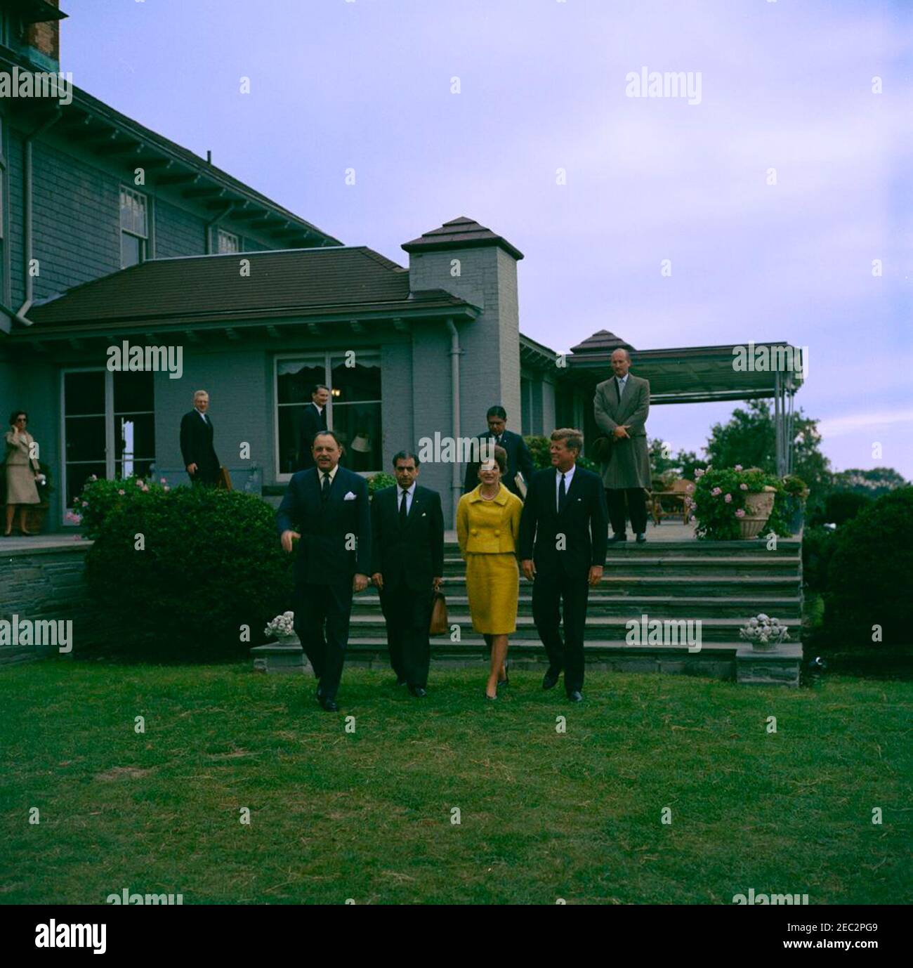 Visit of Muhammad Ayub Khan, President of Pakistan, Newport, Rhode Island. President John F. Kennedy and First Lady Jacqueline Kennedy visit with President of Pakistan, Muhammad Ayub Khan, at Hammersmith Farm in Newport, Rhode Island. Left to right (in foreground): President Ayub Khan; Ambassador of Pakistan, Aziz Ahmed; Mrs. Kennedy; President Kennedy. Also pictured: U.S. Assistant Secretary of State for Near Eastern and South Asian Affairs, Phillips Talbot; U.S. Ambassador to Pakistan, Walter P. McConaughy; Secretary of Information in the Ministry of Education and Information of Pakistan, Qu Stock Photo