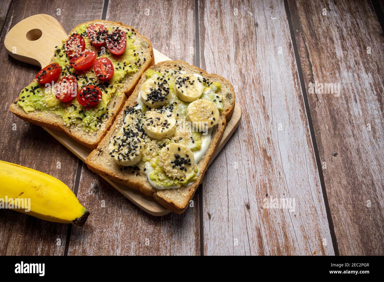 Healthy breakfast toasts with Avocado toast, tomato, banana, Yoghurt