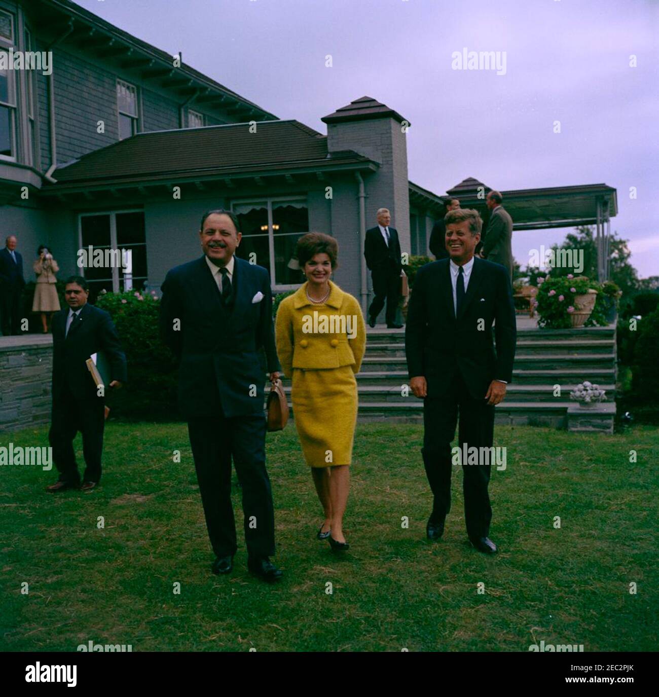 Visit of Muhammad Ayub Khan, President of Pakistan, Newport, Rhode Island. President John F. Kennedy and First Lady Jacqueline Kennedy visit with President of Pakistan, Muhammad Ayub Khan, at Hammersmith Farm in Newport, Rhode Island. Left to right (in foreground): Secretary of Information in the Ministry of Education and Information of Pakistan, Qudratullu0101h Shahu0101b; President Ayub Khan; Mrs. Kennedy; President Kennedy. Also pictured: U.S. Assistant Secretary of State for Near Eastern and South Asian Affairs, Phillips Talbot; U.S. Ambassador to Pakistan, Walter P. McConaughy; U.S. Chi Stock Photo