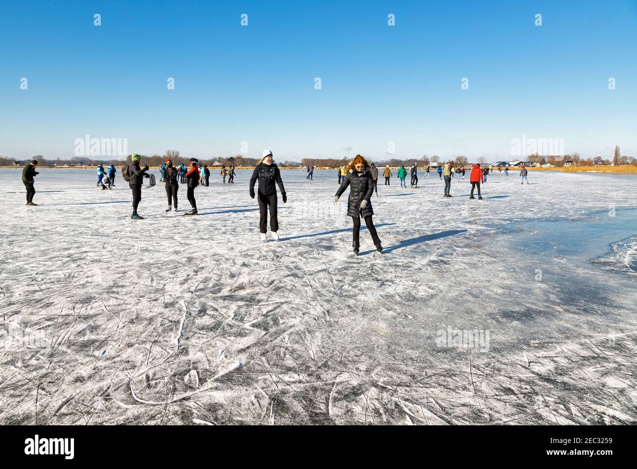 Ice skating on Vogelplas Starrevaart, a lake in a polder at Leidschendam, in South Holland. the Netherlands Stock Photo