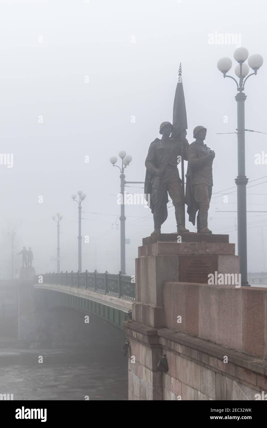 Vilnius, Lithuania - February 23, 2014: Historical image of Soviet sculptures on Green Bridge in fog. Soviet era statues were removed on 19 July 2015, Stock Photo
