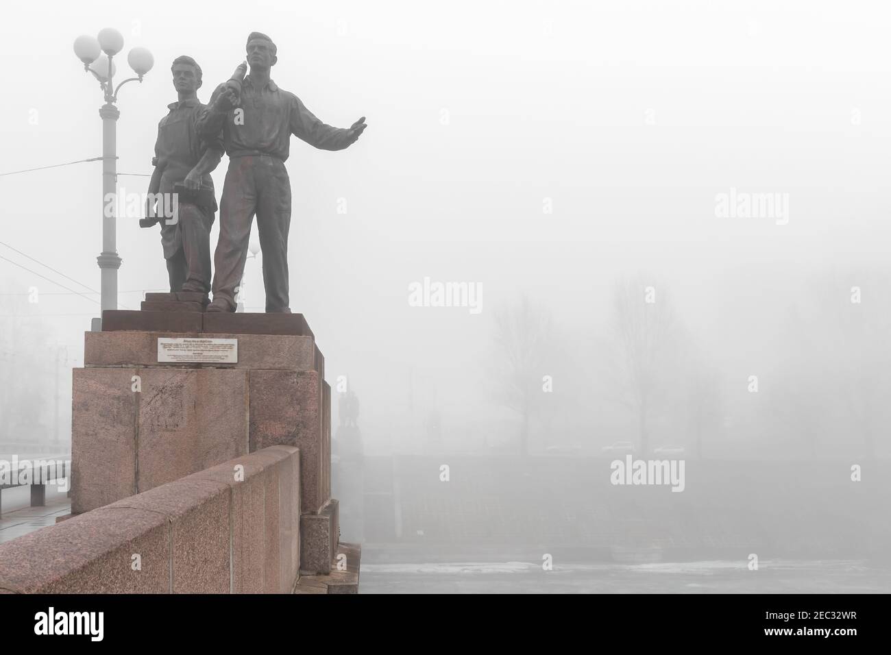 Vilnius, Lithuania - February 23, 2014: Historical image of Soviet sculptures on Green Bridge in fog. Soviet era statues were removed on 19 July 2015, Stock Photo
