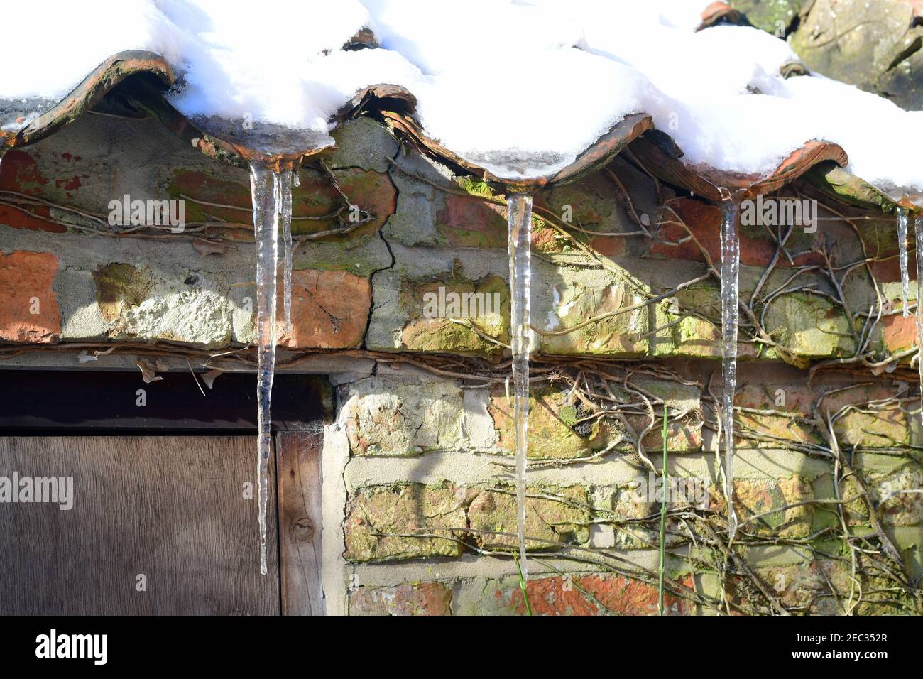 icicles forming on rooftop ellerton york yorkshire united kingdom Stock Photo