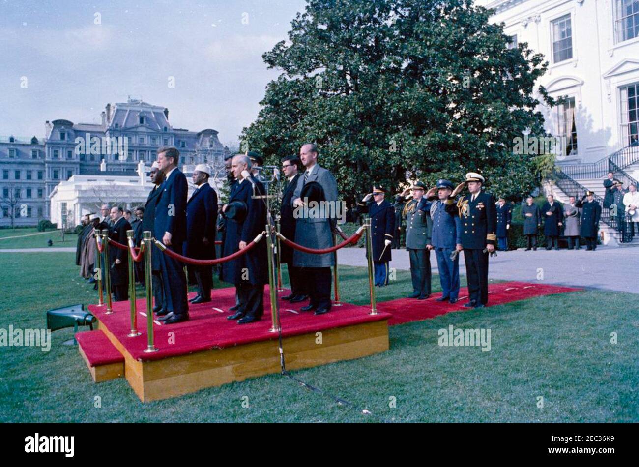 Arrival ceremonies for Abdirashid Ali Shermarke, Prime Minister of the Somali Republic, 11:45AM. Arrival ceremonies for Prime Minister of the Somali Republic, Dr. Abdirashid Ali Shermarke. Standing on reviewing platform in foreground (L-R): Prime Minister Shermarke; President John F. Kennedy; Minister of Foreign Affairs of the Somali Republic, Abdullahi Issa Mohamud; Ambassador of the Somali Republic, Dr. Omar Mohallim Mohamed (partially hidden); U.S. Deputy Assistant Secretary of State for African Affairs, Henry J. Tasca; Chief of Staff of the United States Army, General Earle G. Wheeler (in Stock Photo