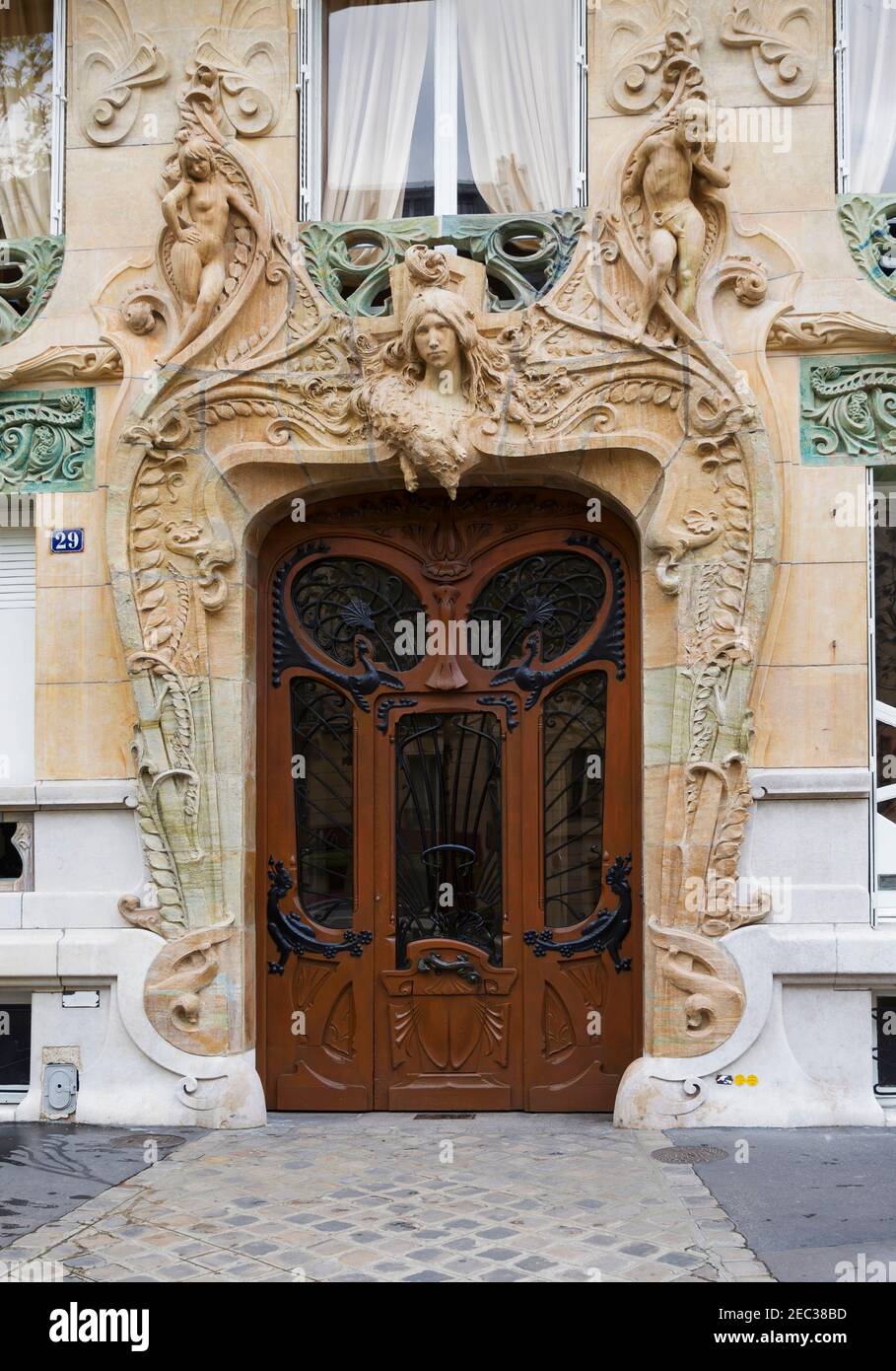 Door of 29 Avenue Rapp, Paris.  Art Nouveau building by architect Jules Aimé Lavirotte built in 1901. Stock Photo