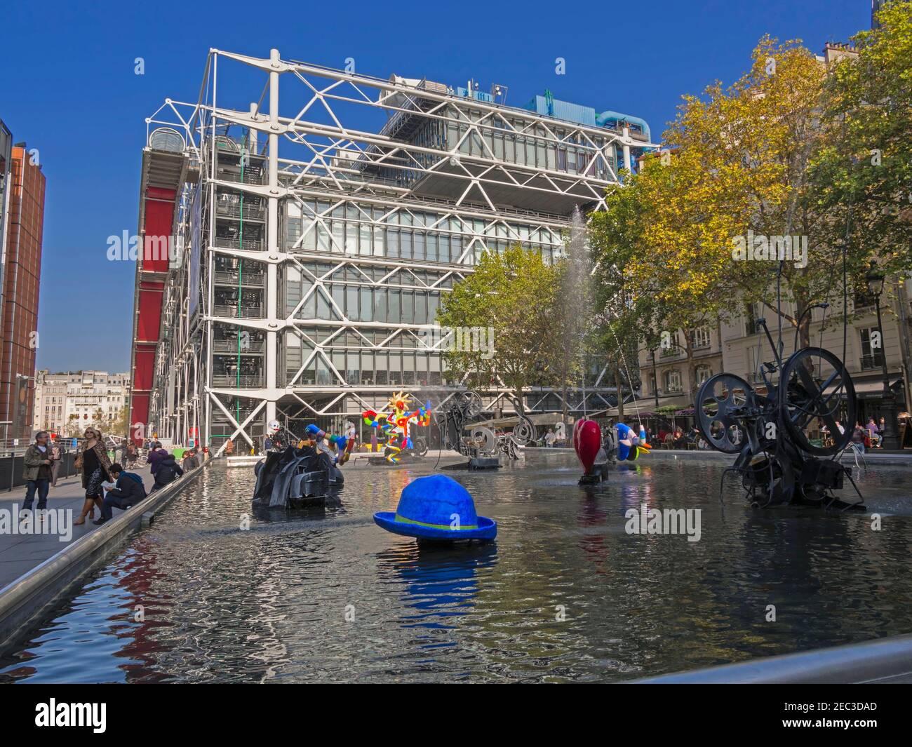 Stravinsky Fountain and the Pompidou Centre, Paris. The fountain is a shallow basin with 16 works of sculpture. Stock Photo