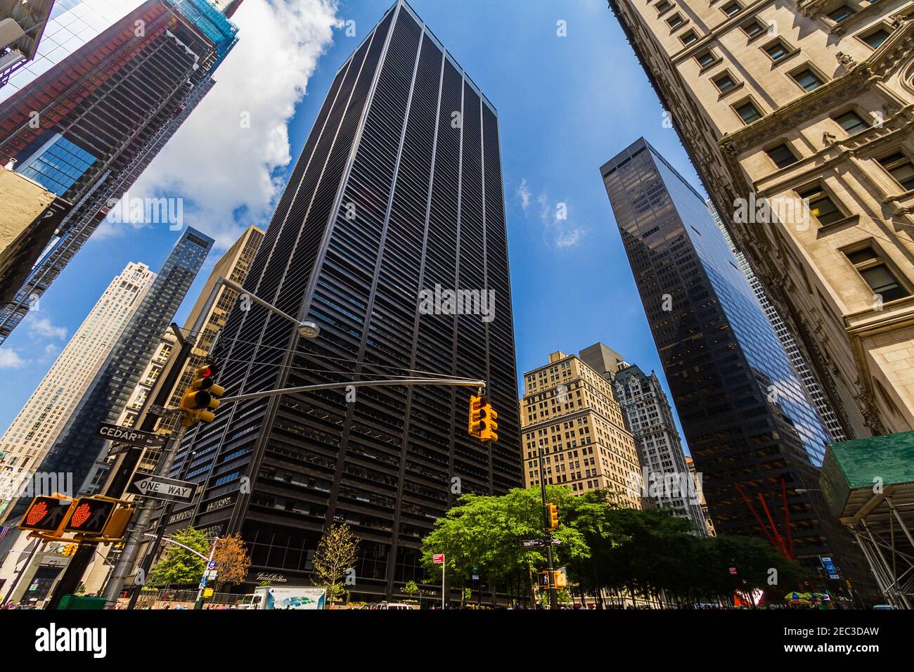 Street view of some buildings and skyscrapers in the Financial District in New York with Cedar Street sign Stock Photo
