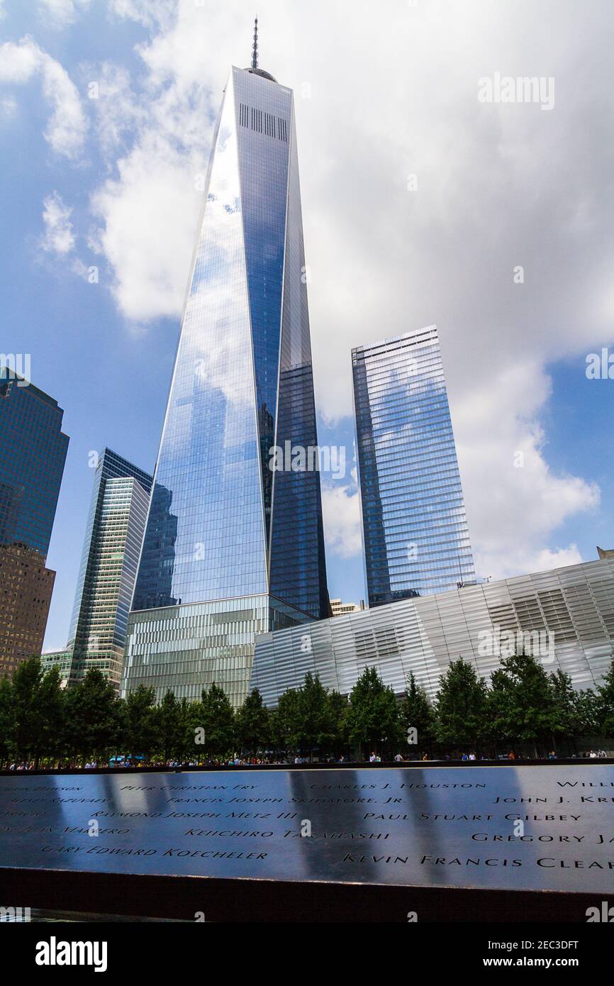 View of the One World Trade Center and the 9-11 memorial with the names of the victims Stock Photo