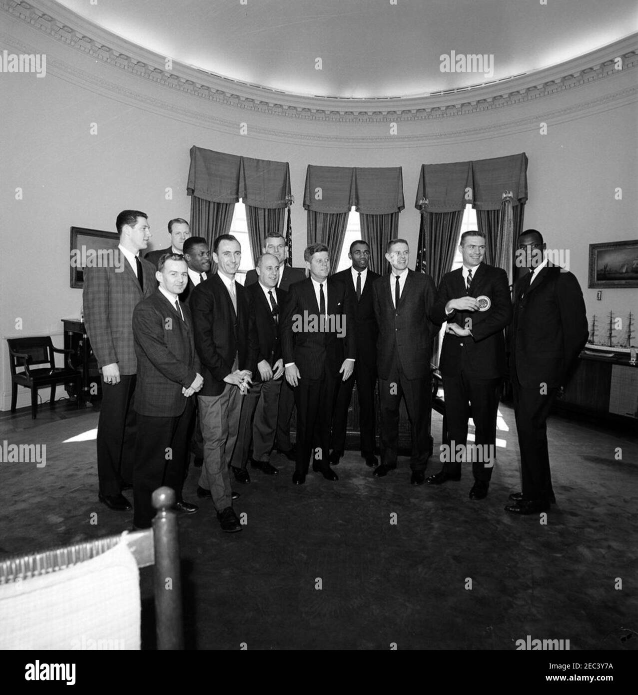 Visit of the Boston Celtics basketball team, 1:00PM. Members of the  National Basketball Association (NBA) Boston Celtics team visit with  President John F. Kennedy in the Oval Office during a tour of