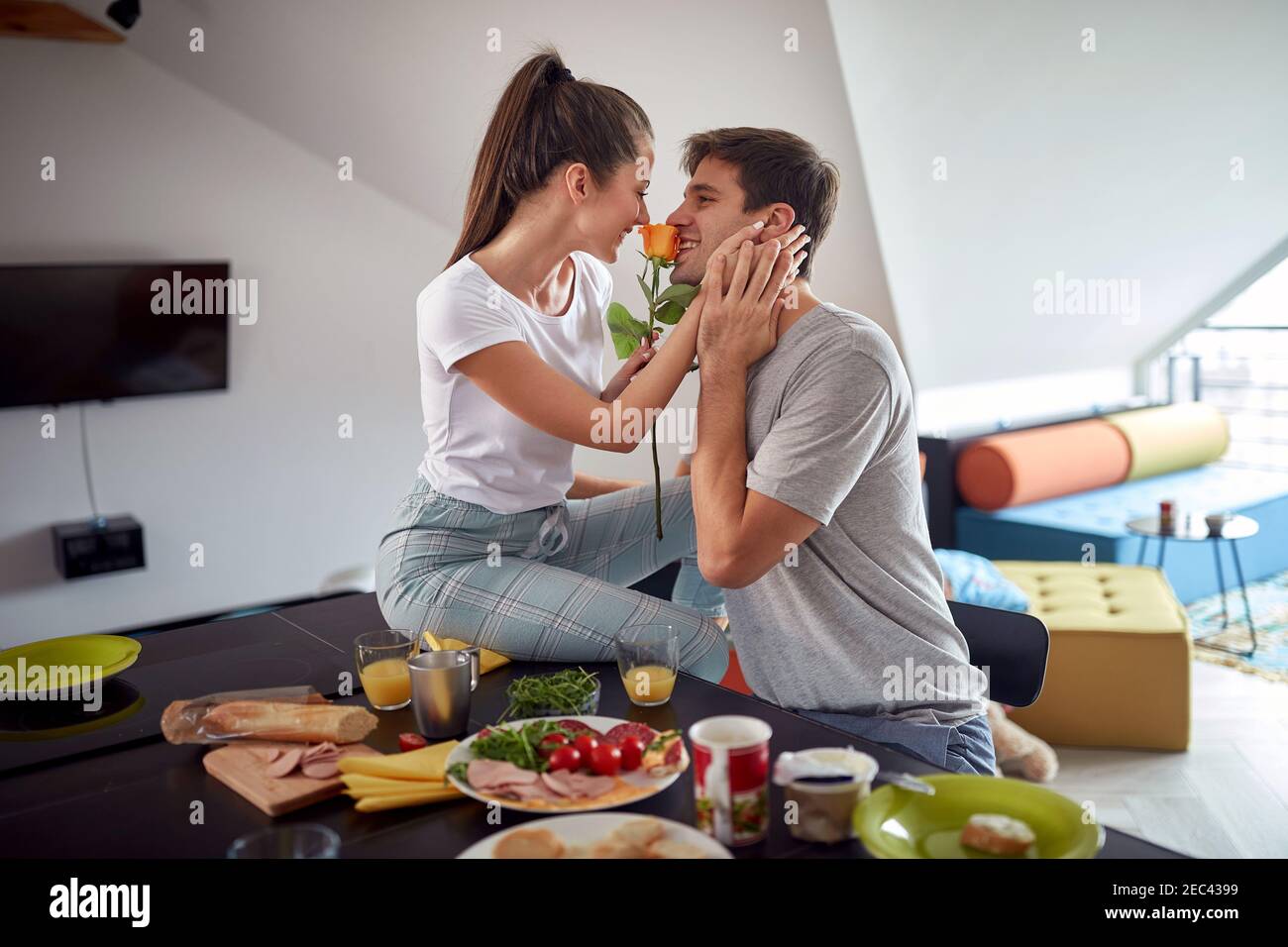 Romantic couple having breakfast together at home Stock Photo Alamy