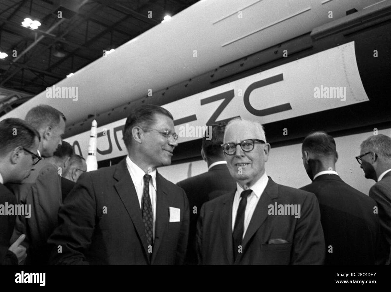 Inspection tour of NASA installations: Huntsville Alabama, Redstone Army Airfield and George C. Marshall Space Flight Center, 9:35AM. Secretary of Defense, Robert S. McNamara (left), and Representative George P. Miller (California) stand in front an exhibit of the Saturn rocket, during President John F. Kennedyu0027s visit to the George C. Marshall Space Flight Center (MSFC) at Redstone Arsenal, Huntsville, Alabama. Also pictured: Director of Defense Research and Engineering for the Department of Defense, Dr. Harold Brown; Director of the Bureau of the Budget, David E. Bell; Associate Adminis Stock Photo