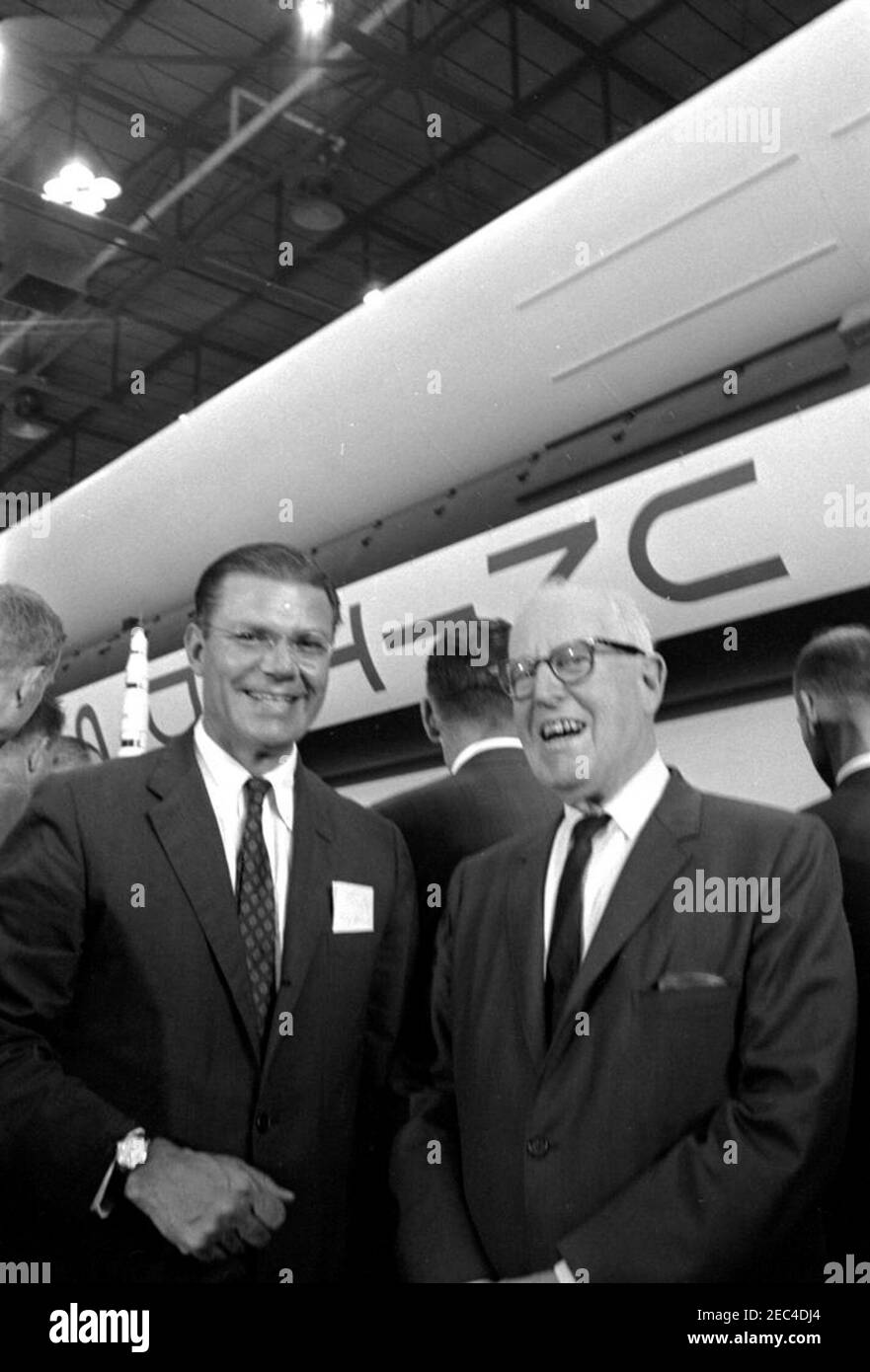 Inspection tour of NASA installations: Huntsville Alabama, Redstone Army Airfield and George C. Marshall Space Flight Center, 9:35AM. Secretary of Defense, Robert S. McNamara (left), and Representative George P. Miller (California) stand in front of an exhibit of the Saturn rocket, during President John F. Kennedyu0027s visit to the George C. Marshall Space Flight Center (MSFC) at Redstone Arsenal, Huntsville, Alabama. President Kennedy visited the MSFC as part of a two-day inspection tour of National Aeronautics and Space Administration (NASA) field installations. Stock Photo