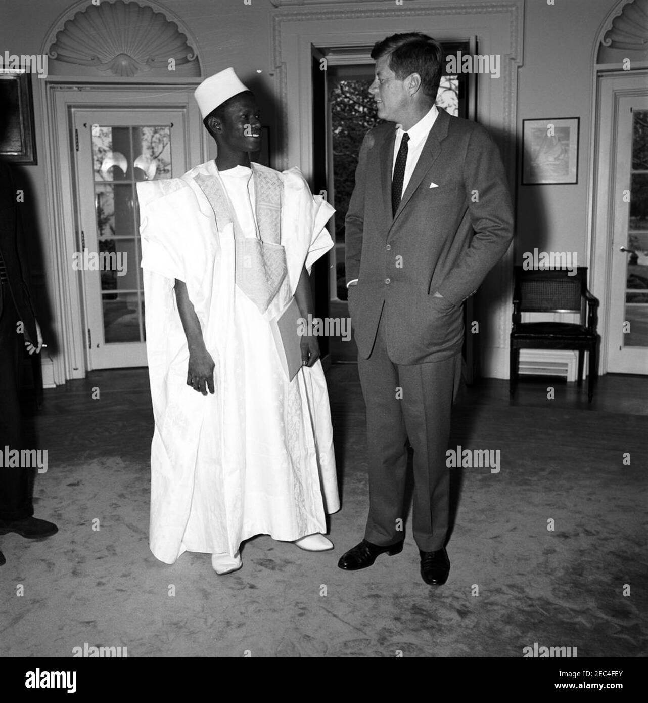 Meeting with the Ambassador of Mali, Oumar Sow, 12:08PM. President John F. Kennedy meets with the newly-appointed Ambassador of the Republic of Mali, Oumar Sow (left). Ambassador Sow presented his credentials to President Kennedy. Oval Office, White House, Washington, D.C. [Photograph by Harold Sellers] Stock Photo