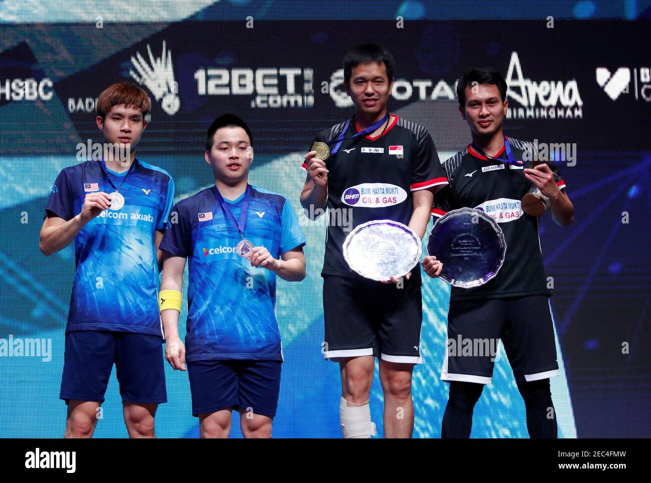 Badminton - All England Open Badminton Championships - Arena Birmingham,  Birmingham, Britain - March 10, 2019 Indonesia's Hendra Setiawan and  Mohammad Ahsan pose with the trophies and their winners medals with second