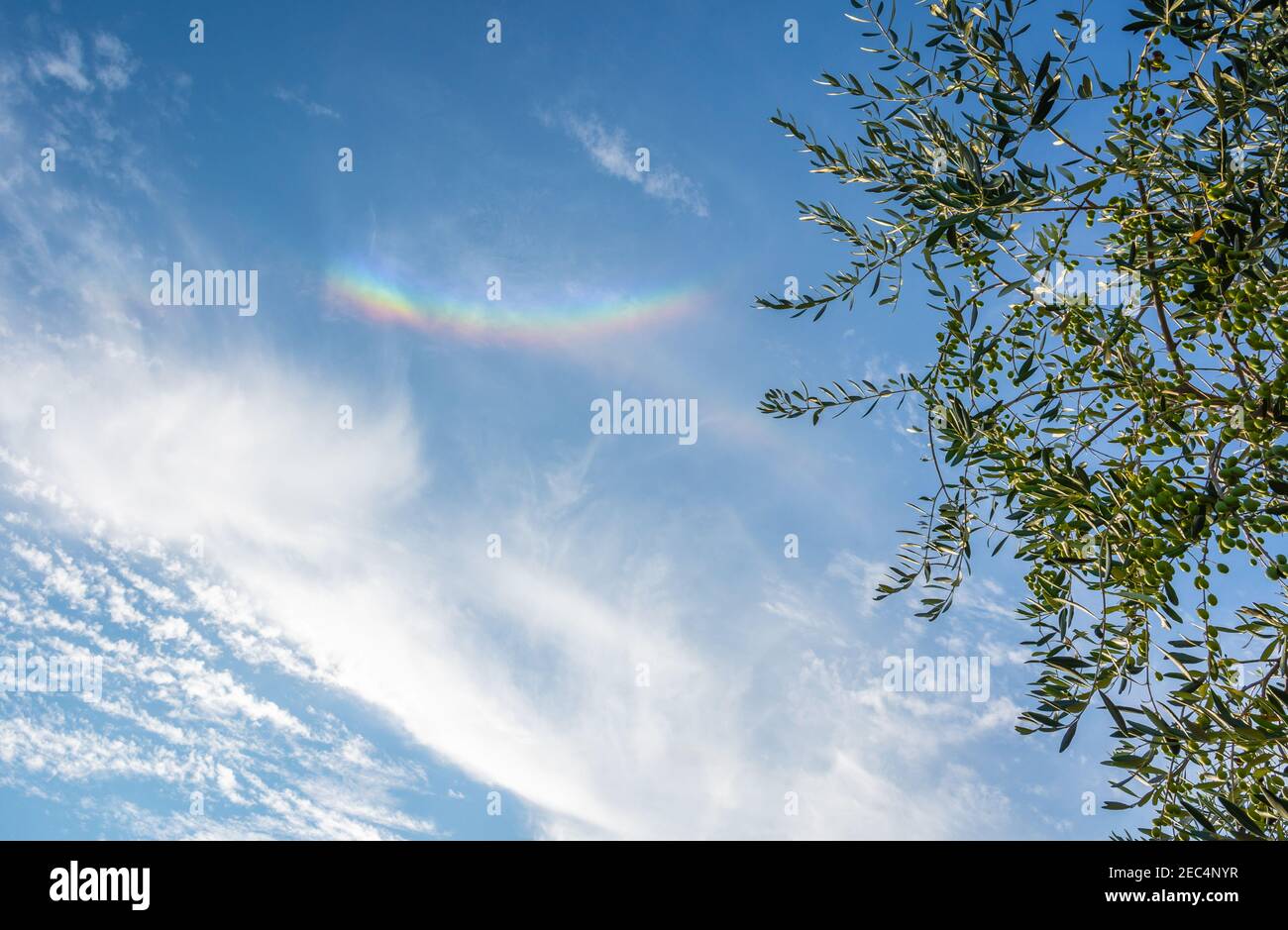 Sun dog (Parhelion)  the sky above the walls of Monteriggioni village in the Siena province, Tuscany - Italy Stock Photo