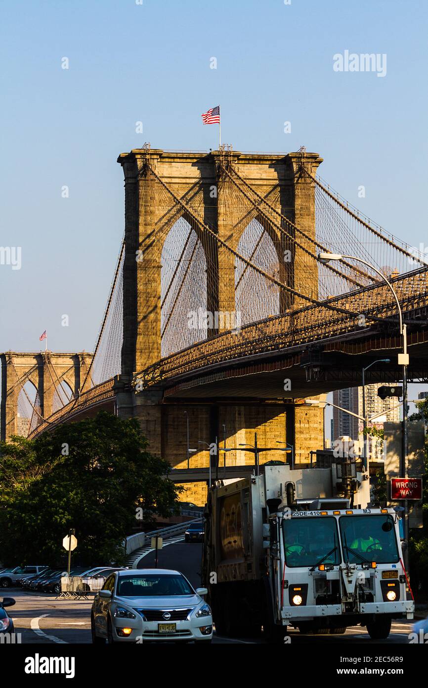Trucks and vehicles in the traffic under Brooklyn Bridge in Manhattan, New York City Stock Photo