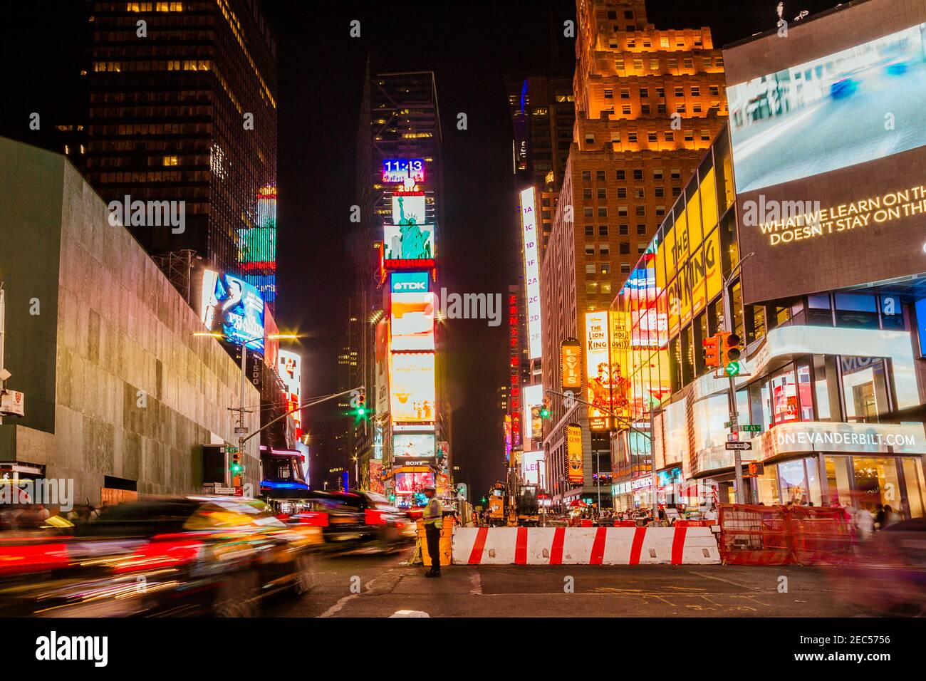 Traffic at Times Square at night with blurred cars in movement Stock Photo