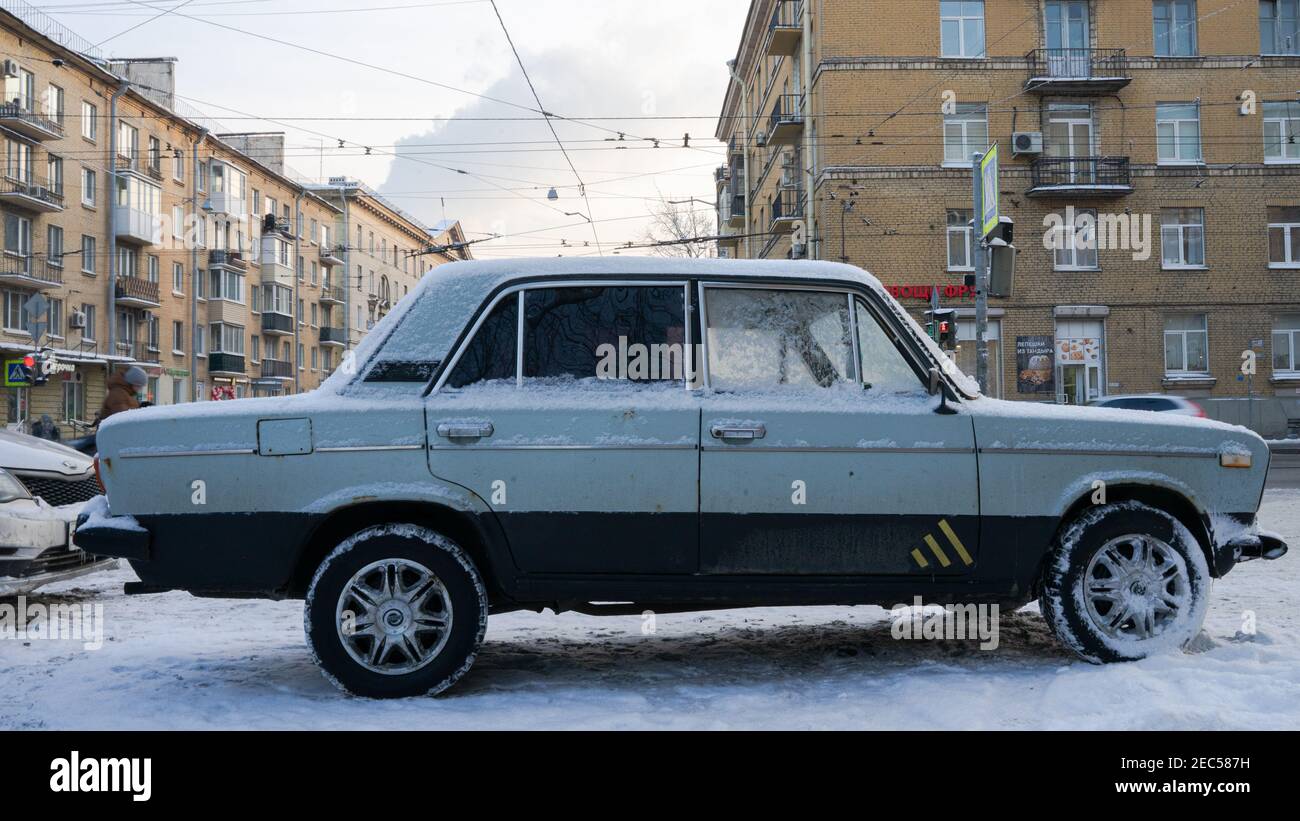 Old Soviet VAZ (Zhiguli) 2105 car, empty in February frost in St. petersburg, Russia, one the most popular and accessible vehicles in Soviet times. Stock Photo
