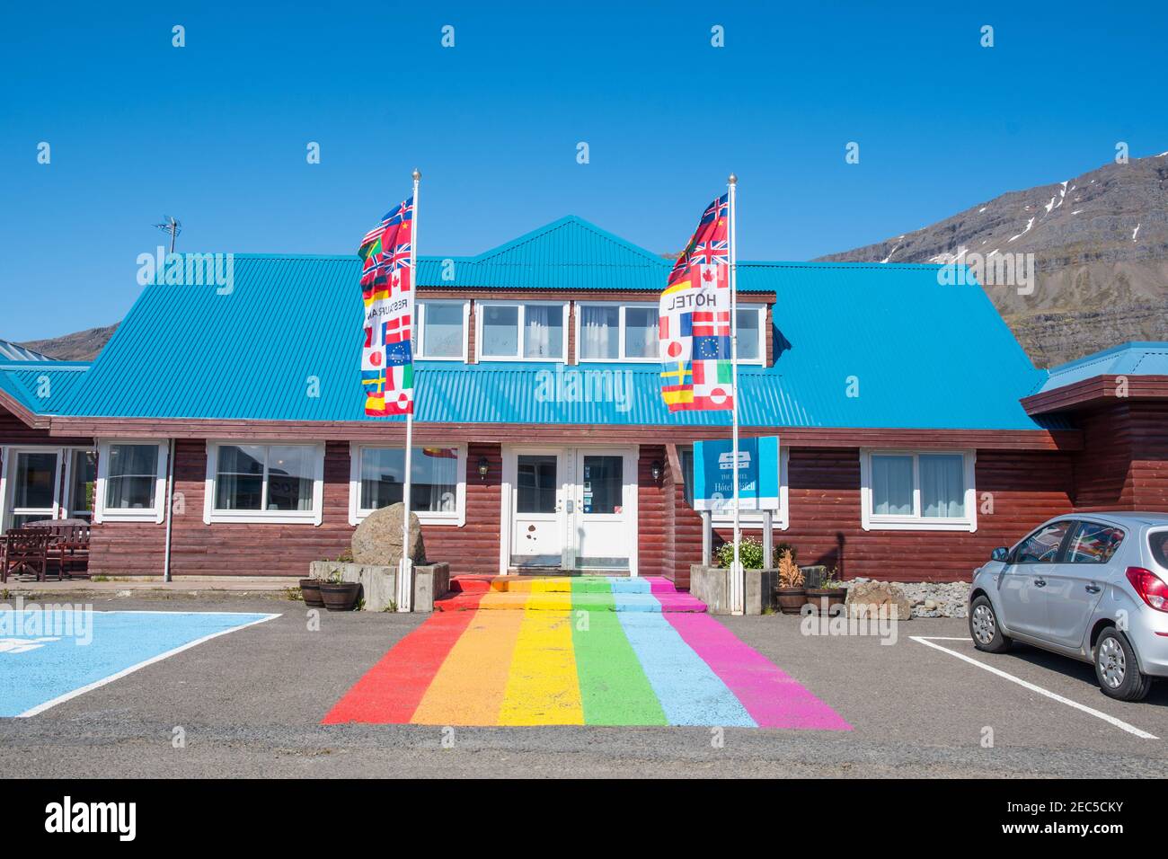 Breiddalsvik Iceland - June 10. 2019: rainbow flag painted on the ground in front of hotel Blafell in town of Breiddalsvik in east Iceland Stock Photo