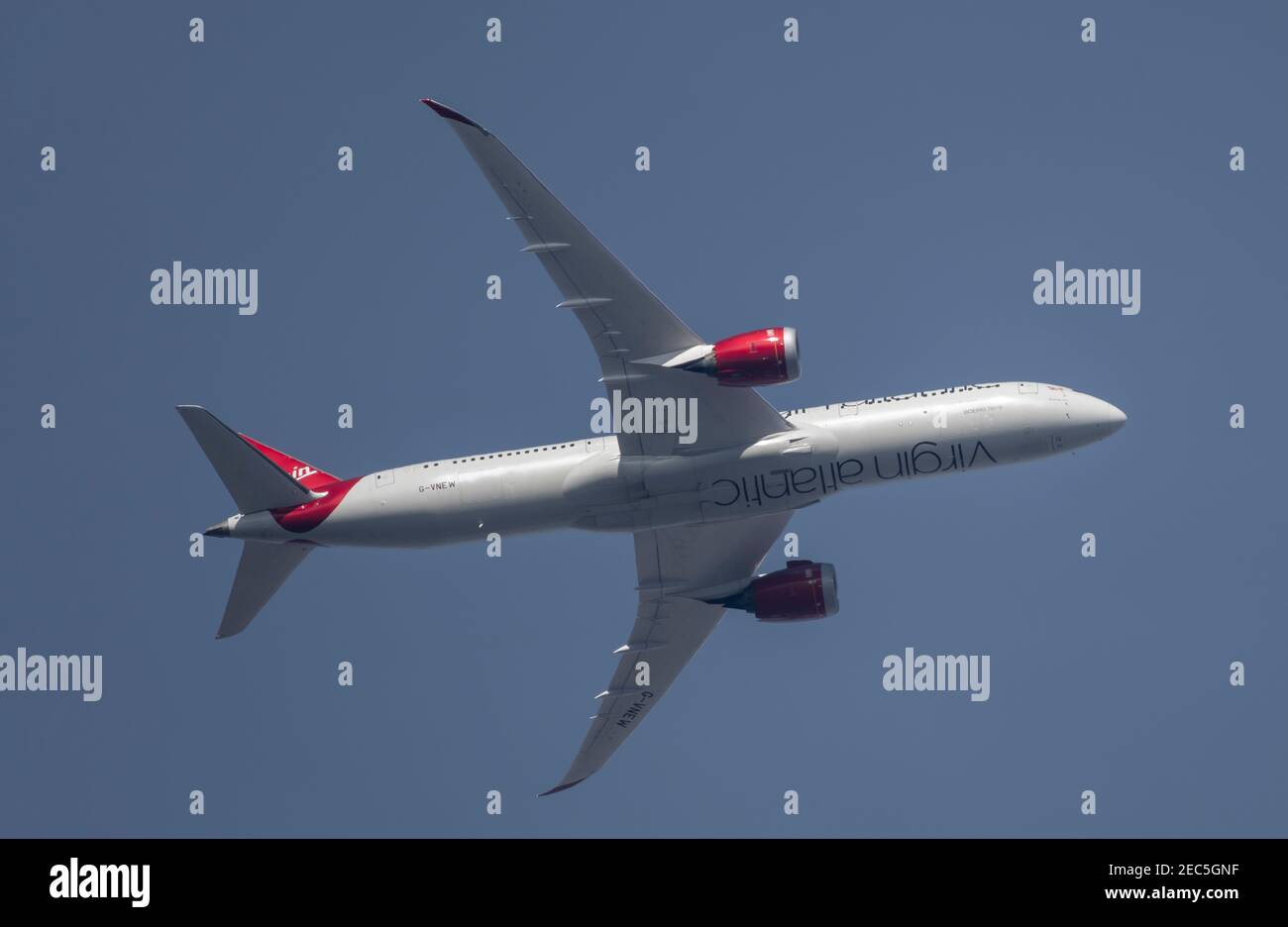 London, UK. 13 February 2021. Air traffic over London during the Covid-19 pandemic. Virgin Atlantic Boeing 787 Dreamliner ‘Birthday Girl’ G-VNEW flies over Wimbledon after leaving London Heathrow en route to Islamabad in hazy afternoon sky. Credit: Malcolm Park/Alamy. Stock Photo