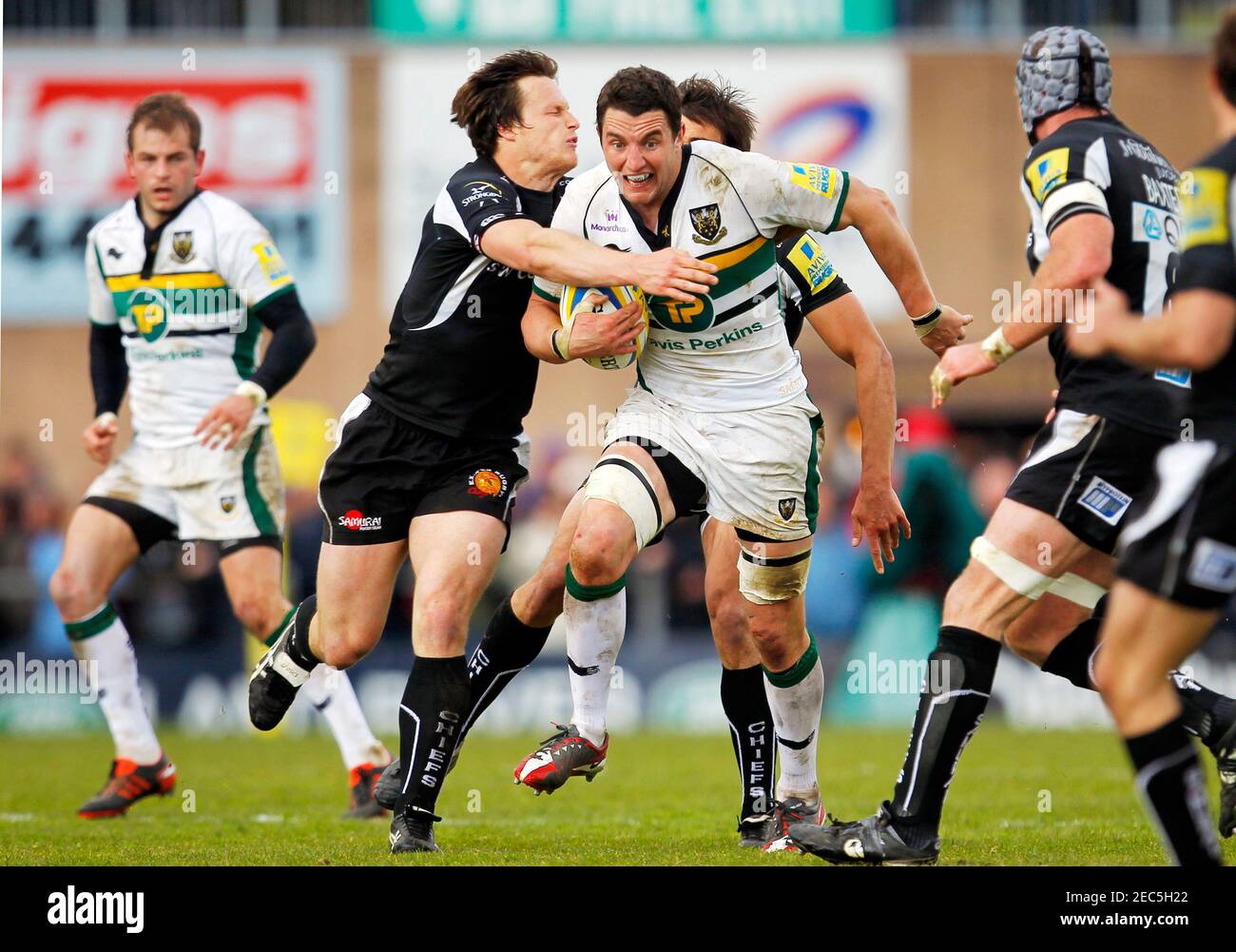 Rugby Union - Exeter Chiefs v Northampton Saints Aviva Premiership  - Sandy Park  - 22/4/12  Northampton Saints' Phil Dowson (C) in action with Exeter Chiefs' Bryan Rennie (L)  Mandatory Credit: Action Images / James Benwell  Livepic Stock Photo